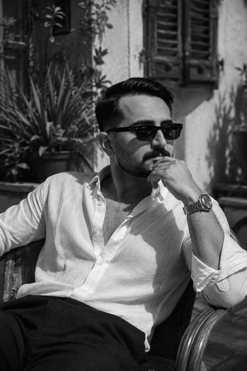 Pouya Karimi, seated outdoors